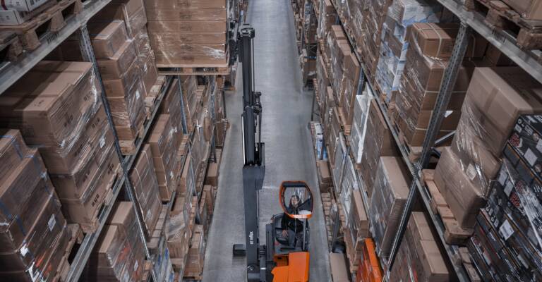BT Reflex E-series reach truck forklift stacking in warehouse