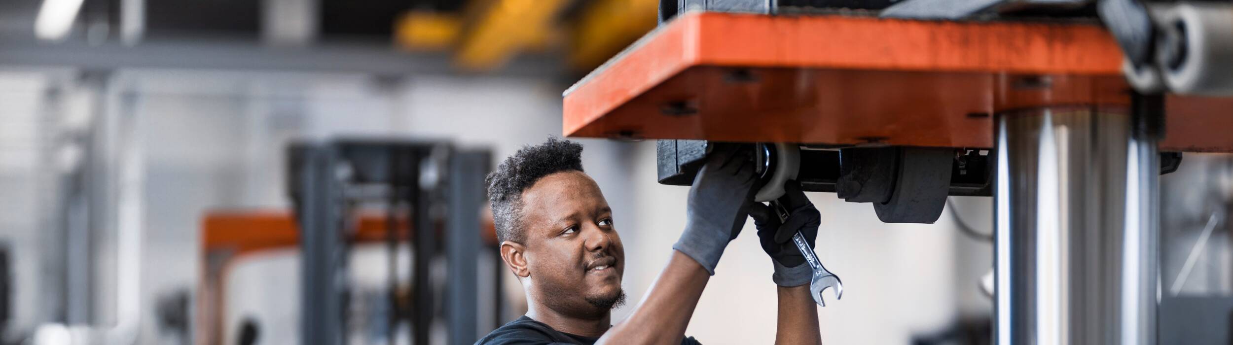 toyota technician working on forklift truck